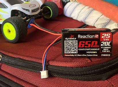 Image of a Spektrum LiPo battery atop a suitcase.